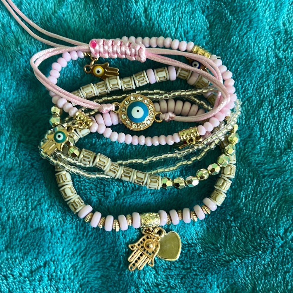 Pink evil eye 6 strands of baby pink & gold bracelets
